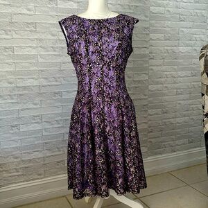 Nice party dress size 10 Liliac color with black accents simple but elegant.